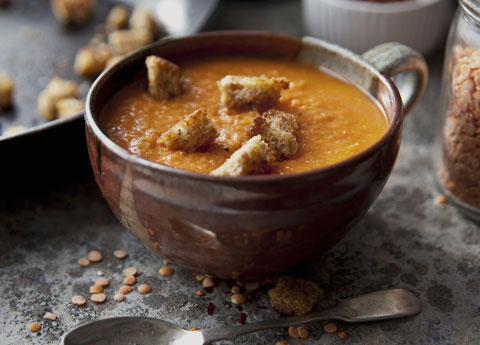 Spicy red lentil soup and tomato with croutons